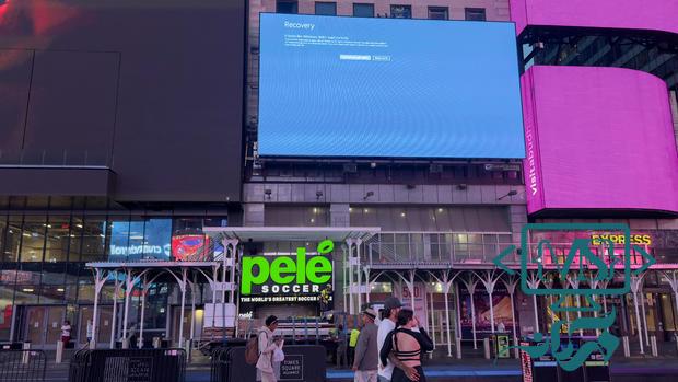 A digital billboard in New York City's Times Square displaying the "blue screen of death" on July 19, 2024, after a communications outage caused by a faulty software update crippled computers worldwide. 